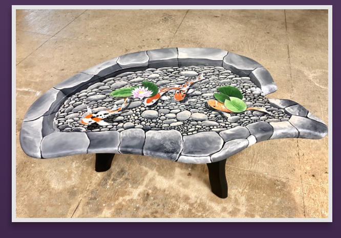 A Koi Pond, trompe l'oeil on a dark, weathered, wood table.