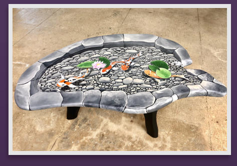 A Koi Pond, trompe l'oeil on a dark, weathered, wood table.