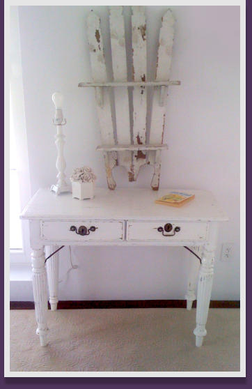 Distressed white on a dark brown desk and accent piece.